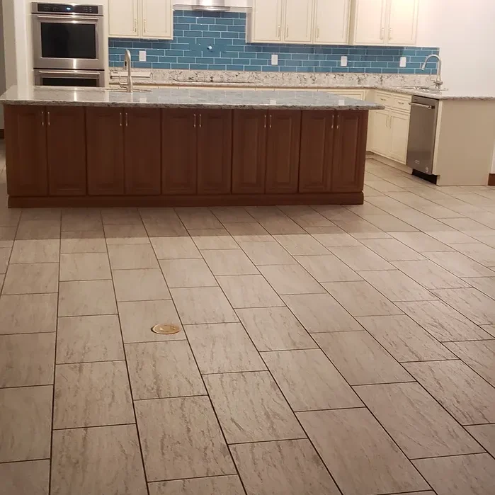 A kitchen with tile floors and a counter top.